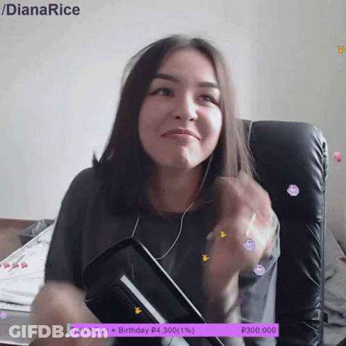 A Woman Is Sitting In A Chair With A Purple Twitchcon Birthday Banner Behind Her GIF