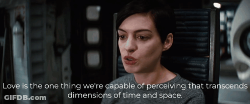 A Woman Is Sitting In A Chair With A Quote That Says Love Is The One Thing We 'Re Capable Of Perceiving GIF