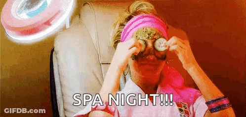 A Woman Is Sitting In A Chair With Cucumber Slices On Her Eyes And The Words Spa Night ! GIF