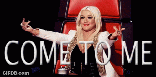 A Woman Is Sitting In A Chair With Her Arms Outstretched And The Words Come To Me Above Her GIF