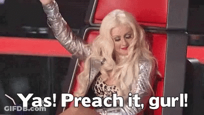 A Woman Is Sitting In A Chair With Her Hand In The Air And The Words `` Yas ! Preach It , Gurl '' . GIF
