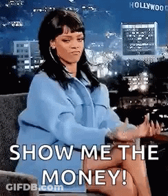 A Woman Is Sitting In A Chair With Her Legs Crossed And Saying `` Show Me The Money '' . GIF