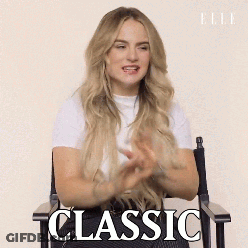 A Woman Is Sitting In A Chair With The Word Classic Written On The Screen GIF