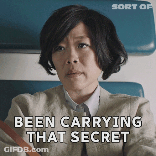 A Woman Is Sitting In A Chair With The Words Been Carrying That Secret Behind Her GIF