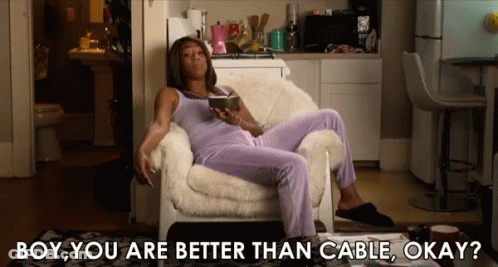A Woman Is Sitting In A Chair With The Words Boy You Are Better Than Cable Okay On The Bottom GIF