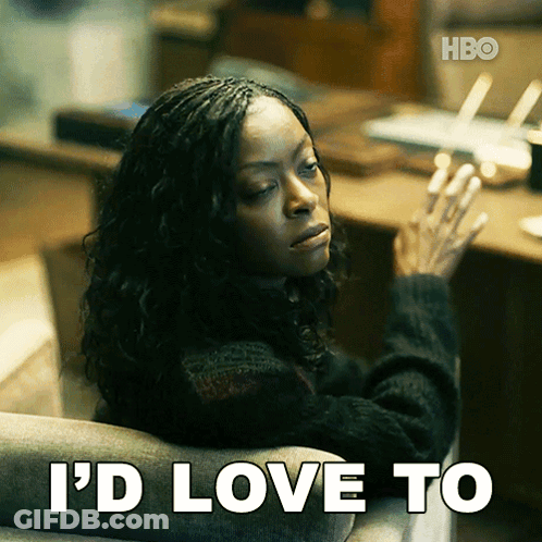 A Woman Is Sitting In A Chair With The Words I 'D Love To Behind Her GIF