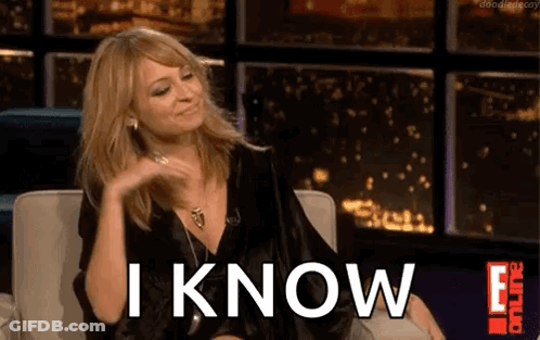 A Woman Is Sitting In A Chair With The Words `` I Know '' Written On The Screen . GIF