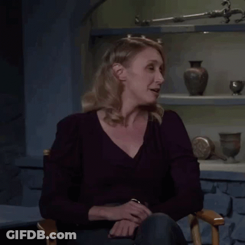 A Woman Is Sitting In A Chair With The Words Not Yet Written On Her Face GIF