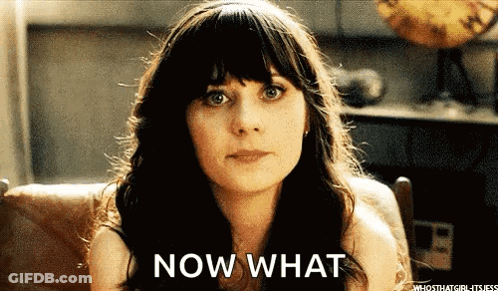 A Woman Is Sitting In A Chair With The Words Now What Written On Her Face GIF