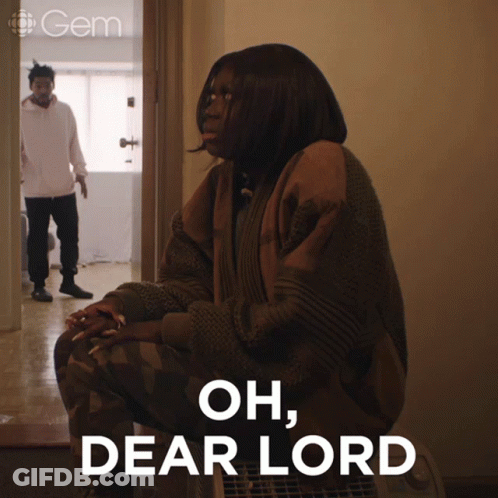 A Woman Is Sitting In A Chair With The Words Oh Dear Lord Written On The Bottom GIF