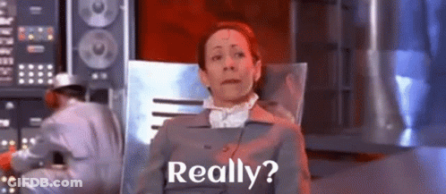 A Woman Is Sitting In A Chair With The Words Really Written On The Screen . GIF
