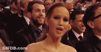 Woman Making Funny Face In Crowd GIF