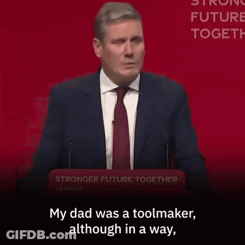A Woman Is Sitting In A Crowd With The Words " My Dad Was A Toolmaker Although In A Way " GIF