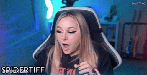 A Woman Is Sitting In A Gaming Chair And The Name Spidertiff Is On The Bottom GIF