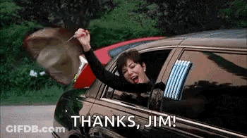 A Woman Is Sitting In A Limousine With Her Arms In The Air And Holding A Key In Her Hand . GIF
