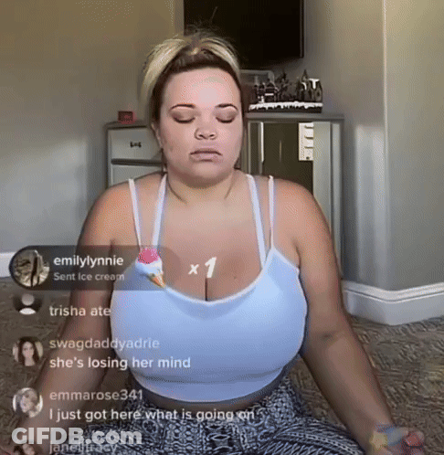 A Woman Is Sitting In A Lotus Position With Her Eyes Closed GIF