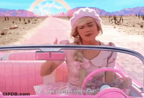 A Woman Is Sitting In A Pink Car And Says " The Closer I Am To Fine " GIF
