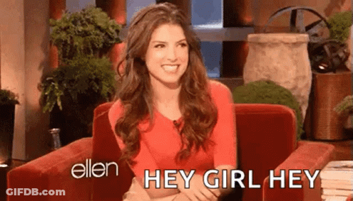 A Woman Is Sitting In A Red Chair And Smiling While Talking To Ellen Degeneres . GIF