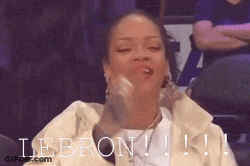 A Woman Is Sitting In A Stadium With The Word Lebron Written On The Bottom GIF