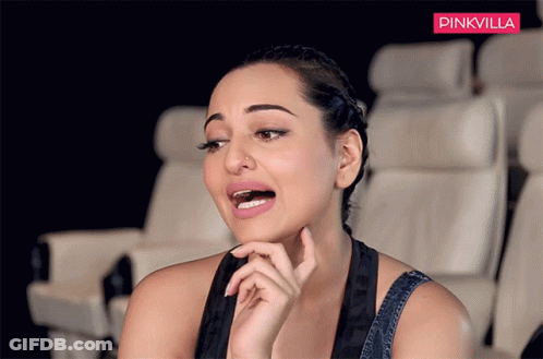 A Woman Is Sitting In A Theatre With A Pinkvilla Logo Behind Her GIF
