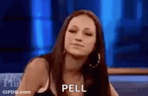A Woman Is Sitting In Front Of A Blue Background And Making A Funny Face While Talking On A Television Show . GIF
