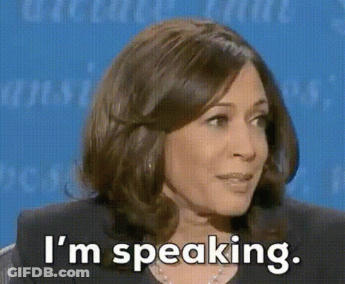A Woman Is Sitting In Front Of A Blue Background And Saying `` I 'M Speaking . '' GIF