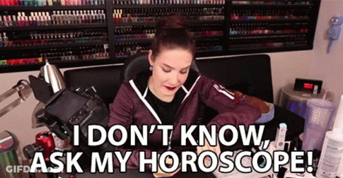 A Woman Is Sitting In Front Of A Camera With The Words I Don 'T Know Ask My Horoscope . GIF