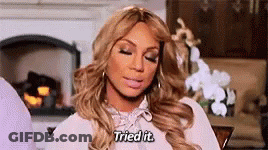 A Woman Is Sitting In Front Of A Fireplace With Her Eyes Closed And Saying `` I Tried It '' . GIF
