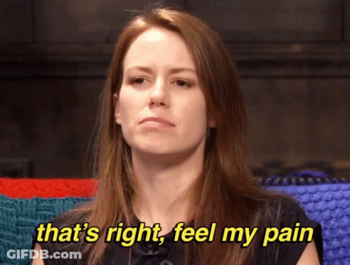 A Woman Is Sitting In Front Of A Knitted Blanket And Says That 'S Right Feel My Pain GIF