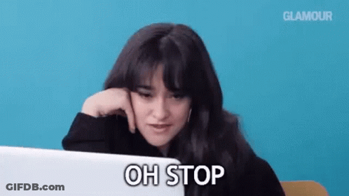 A Woman Is Sitting In Front Of A Laptop Computer And Says Oh Stop . GIF