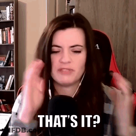 A Woman Is Sitting In Front Of A Microphone And Making A Funny Face While Wearing Headphones . GIF