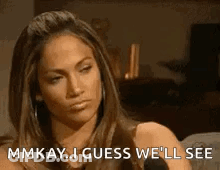 A Woman Is Sitting In Front Of A Microphone And Saying `` Mmkay ... I Guess We 'Ll See '' GIF