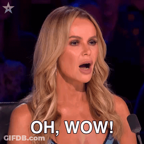 A Woman Is Sitting In Front Of A Microphone And Saying Oh Wow GIF