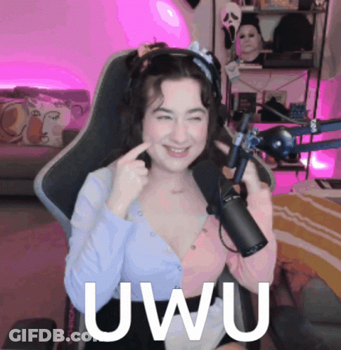 A Woman Is Sitting In Front Of A Microphone And The Word Uwu Is On The Bottom GIF