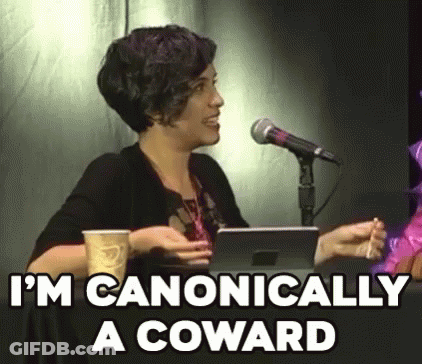 A Woman Is Sitting In Front Of A Microphone Holding A Cup Of Coffee And A Tablet . GIF