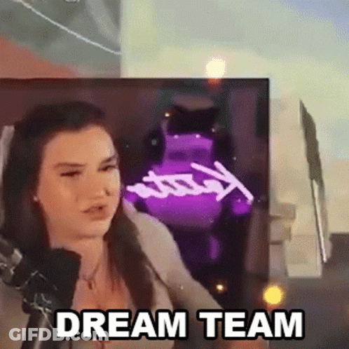 A Woman Is Sitting In Front Of A Microphone With The Words `` Dream Team '' Written On The Screen Behind Her . GIF
