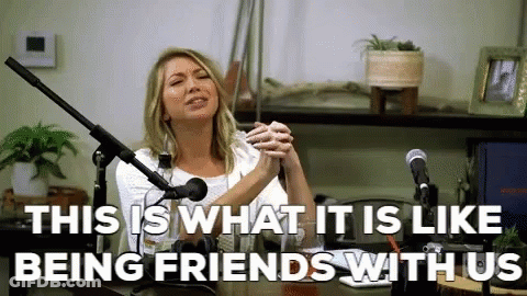 A Woman Is Sitting In Front Of A Microphone With The Words " This Is What It Is Like Being Friends With Us " GIF