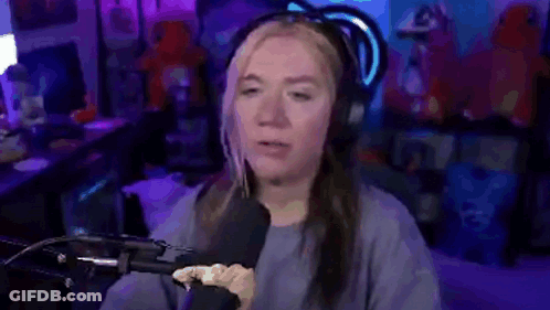 A Woman Is Sitting In Front Of A Microphone With The Words `` What A Save '' . GIF