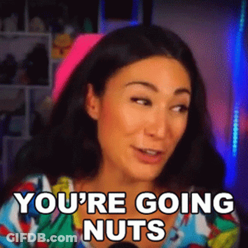 A Woman Is Sitting In Front Of A Microphone With The Words `` You 'Re Going Nuts '' Written On Her Face . GIF