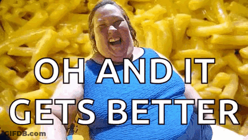 A Woman Is Sitting In Front Of A Pile Of Macaroni And Cheese And Laughing . GIF