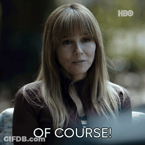 A Woman Is Sitting In Front Of A Screen That Says Of Course GIF