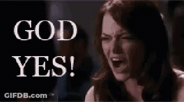 A Woman Is Sitting In Front Of A Sign That Says `` God Yes ! '' GIF