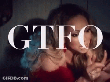 Woman Sitting In Front Of GTFO Sign GIF