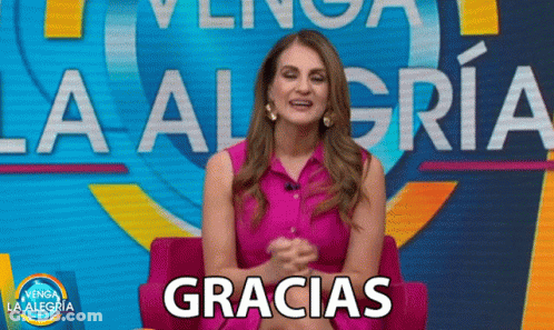 A Woman Is Sitting In Front Of A Sign That Says La Alegria GIF