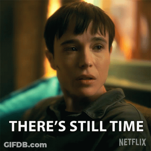A Woman Is Sitting In Front Of A Sign That Says There 'S Still Time On It GIF