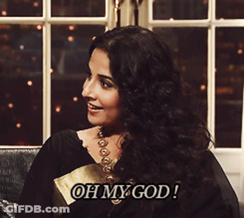 A Woman Is Sitting In Front Of A Window And Says " Oh My God " GIF