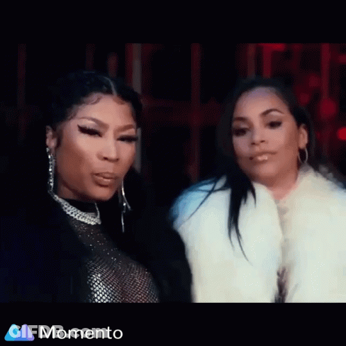 A Woman Is Sitting In The Back Seat Of A Car While Another Woman Looks On . GIF