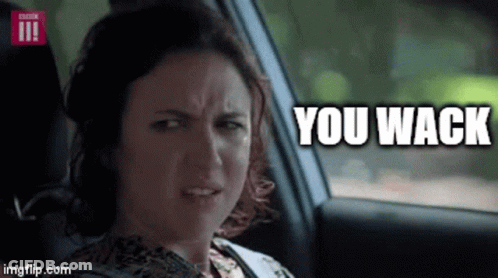 A Woman Is Sitting In The Back Seat Of A Car With The Words You Wack Above Her . GIF