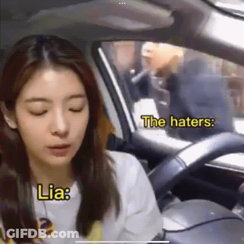 A Woman Is Sitting In The Driver 'S Seat Of A Car While A Man Is Smoking A Cigarette . GIF