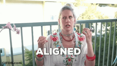 A Woman Is Sitting On A Balcony And The Word Aligned Is Above Her Head GIF